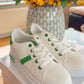 WHITE TRAINER WITH GREEN STRIPE