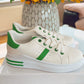 WHITE TRAINER WITH GREEN STRIPE