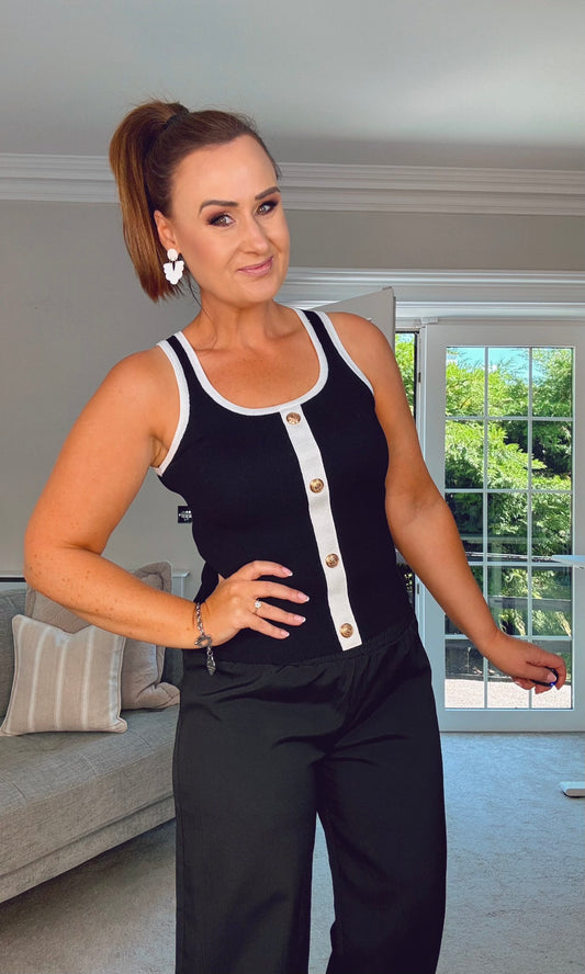 BLACK KNIT VEST WITH WHITE STRIPE AND BUTTON DETAIL